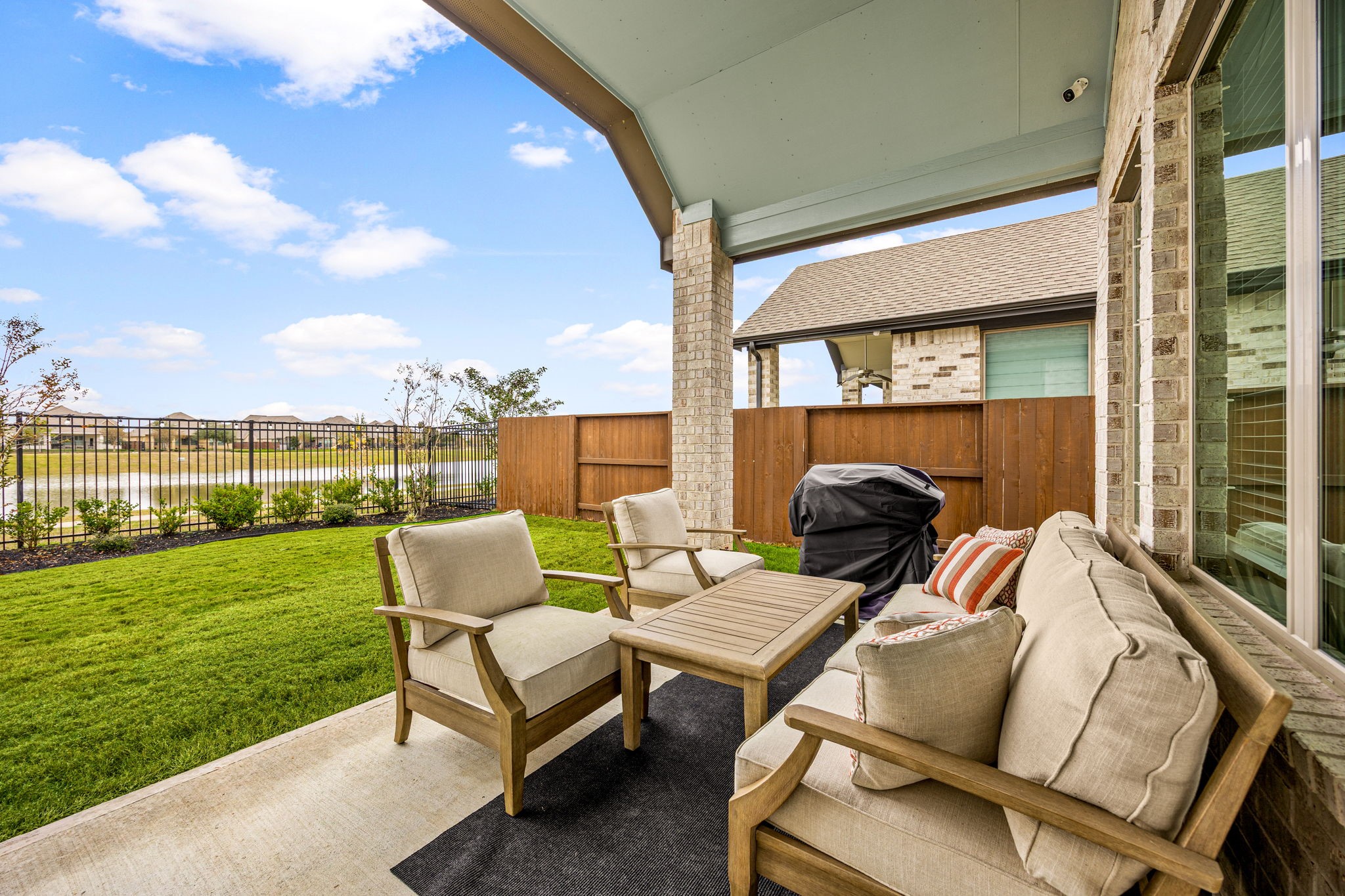 4823 Vaughan Way Iowa Colony, TX 77583 - Photo 24 of 29 a couple of chairs sitting in patio next to a yard