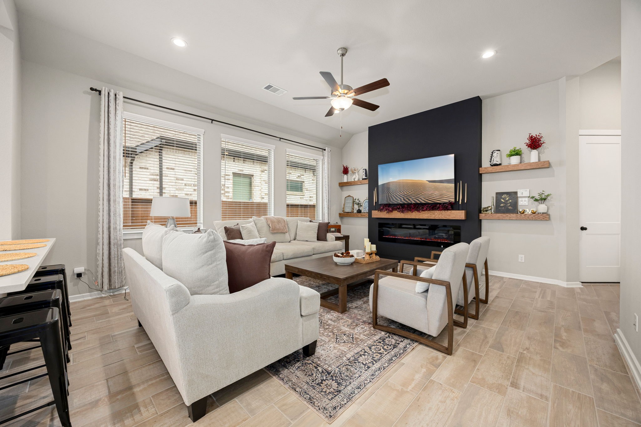 4823 Vaughan Way Iowa Colony, TX 77583 - Photo 5 of 29 a living room with furniture and a flat screen tv