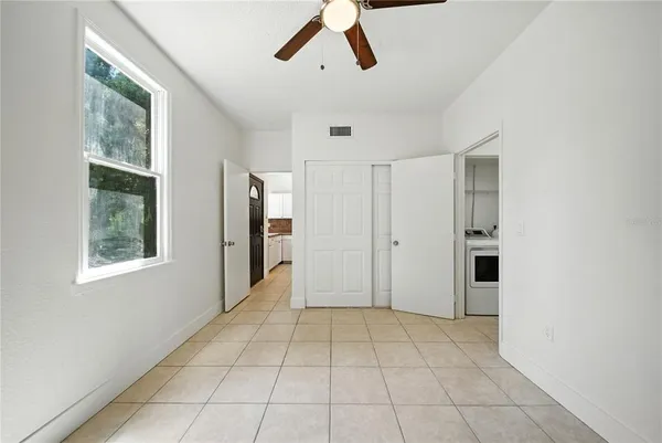 a view of an empty room with a window