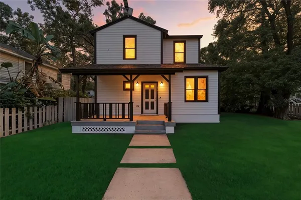 a front view of a house with yard