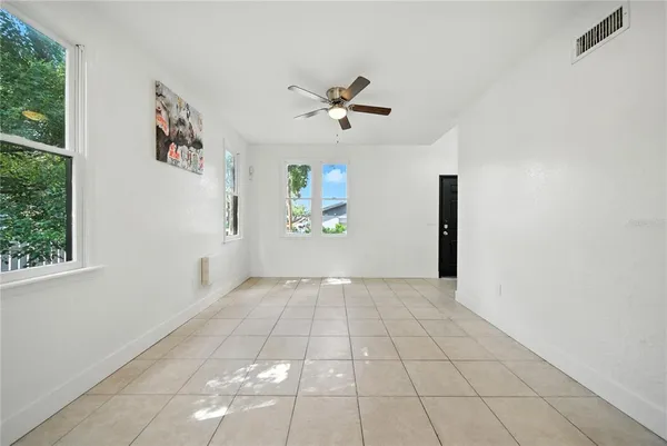 a view of an empty room with a window