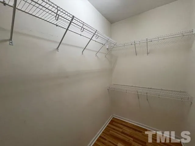 a bathroom with a toilet a sink and a mirror