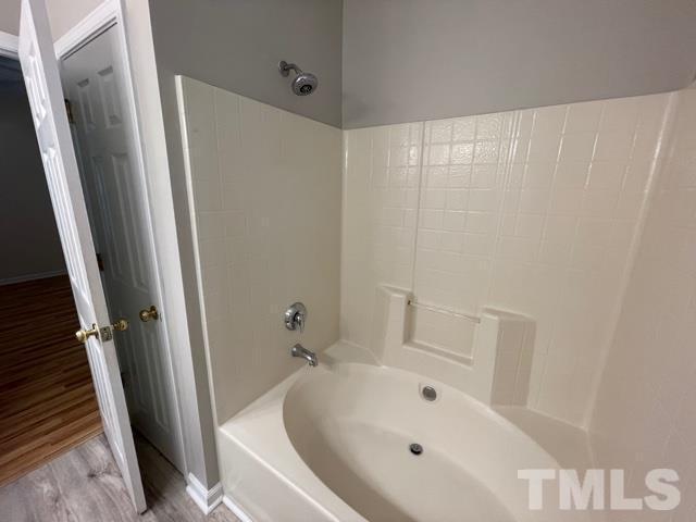 1007 Willowedge Court Knightdale, NC 27545 - Photo 15 of 21 a bathroom with bathtub and shower