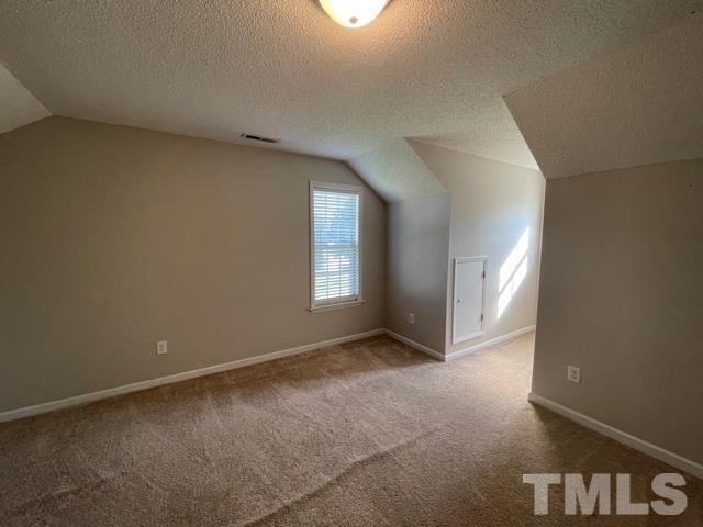 1007 Willowedge Court Knightdale, NC 27545 - Photo 18 of 21 a view of an empty room with a window