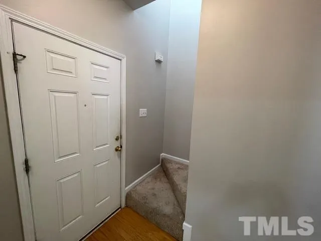 a kitchen with granite countertop a stove and a refrigerator