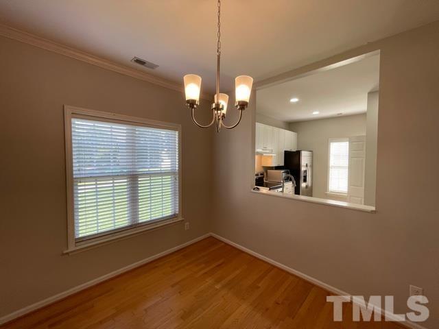 1007 Willowedge Court Knightdale, NC 27545 - Photo 8 of 21 a view of a room with window and wooden floor