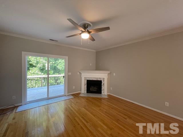1007 Willowedge Court Knightdale, NC 27545 - Photo 9 of 21 a view of empty room with wooden floor and fan
