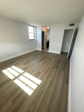 a view of an empty room and window