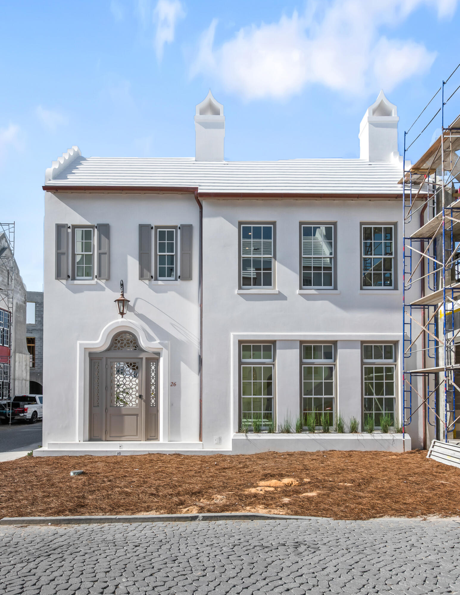 a front view of a house with a yard