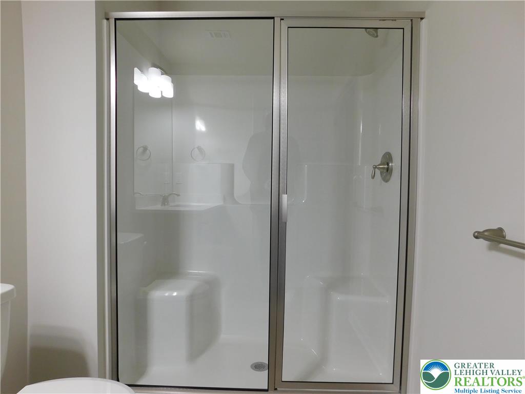 1513 Maple Street, Unit 101 Bethlehem, PA 18017 - Photo 18 of 18 a bathroom that has a glass shower door