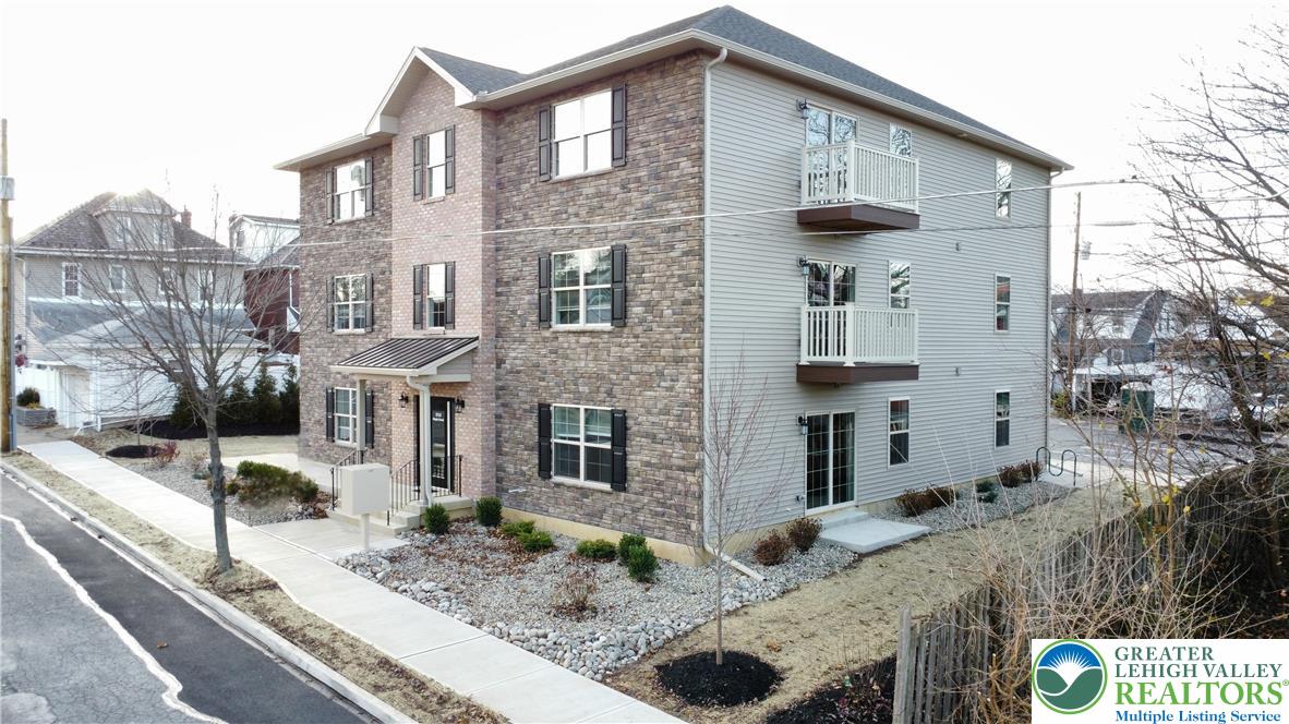 1513 Maple Street, Unit 101 Bethlehem, PA 18017 - Photo 2 of 18 a front view of a house with windows