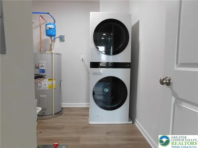 a bathroom with a sink toilet vanity and bathtub