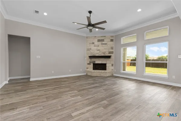 a view of a kitchen with a sink and a fireplace