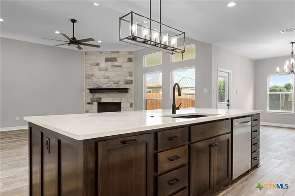 a large kitchen with a table and chairs