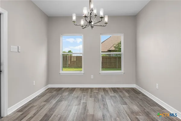a view of kitchen and wooden floor