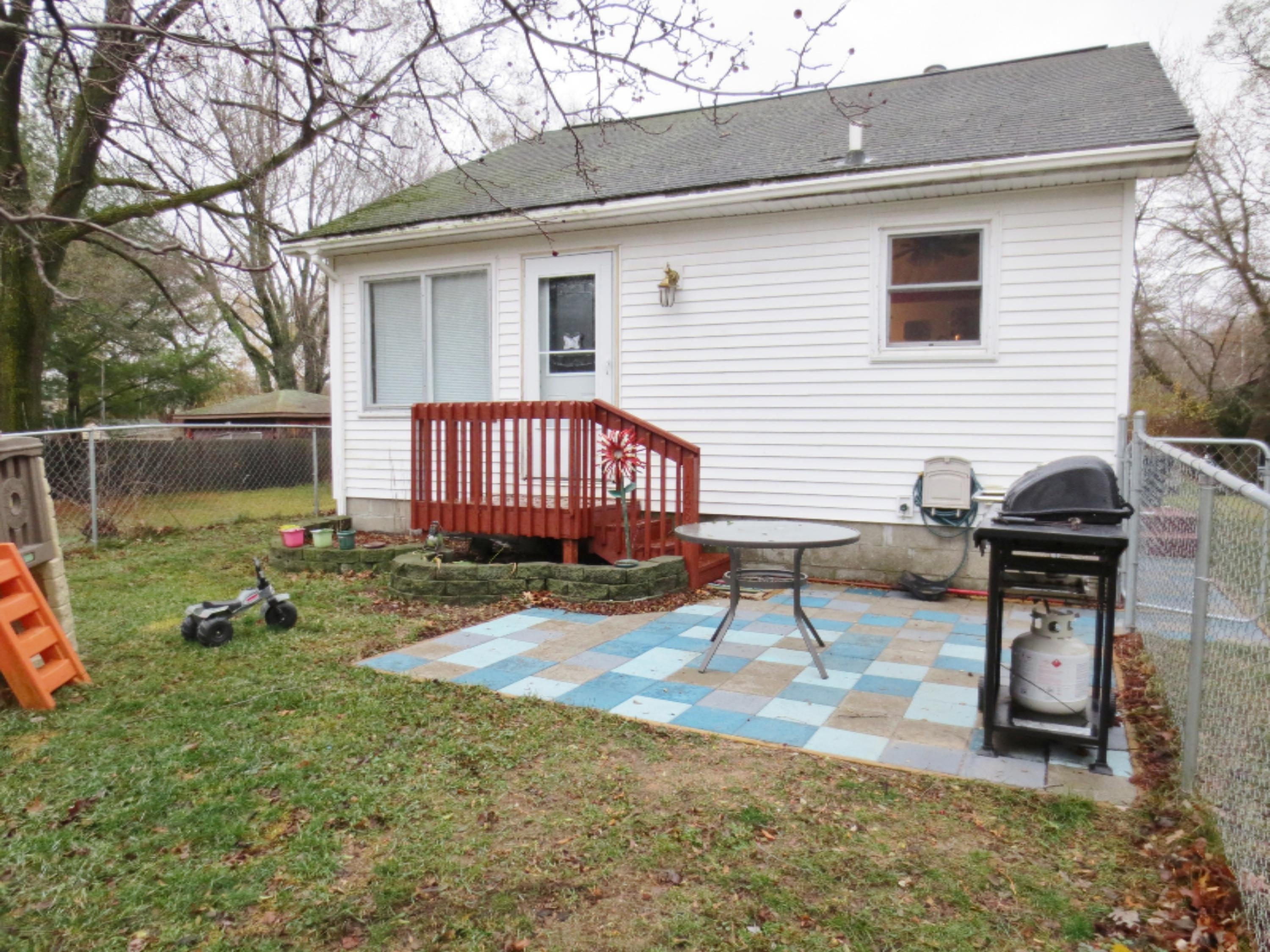 1887 Letart Avenue Muskegon, MI 49441 - Photo 2 of 15 Fenced Yard & Patio Area
