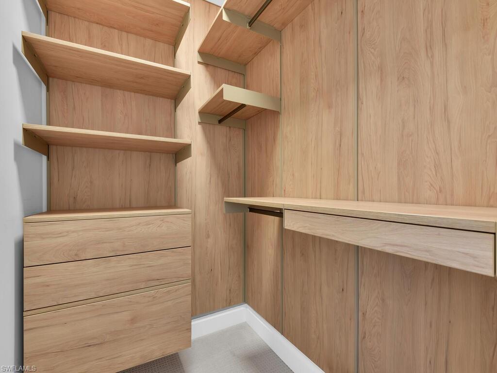 1111 Central Avenue, Unit 216 Naples, FL 34102 - Photo 25 of 50 a view of walk in closet