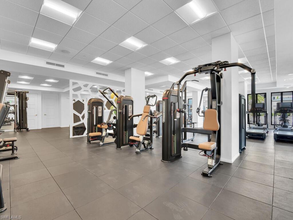 1111 Central Avenue, Unit 216 Naples, FL 34102 - Photo 31 of 50 a view of a room with gym equipment
