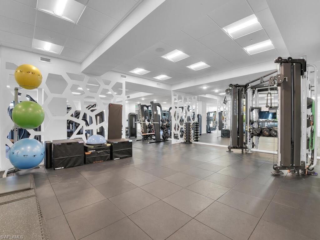 1111 Central Avenue, Unit 216 Naples, FL 34102 - Photo 32 of 50 a view of a room with gym equipment