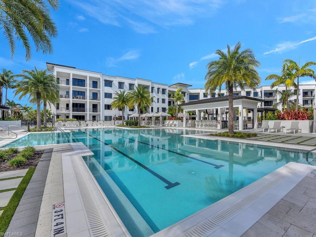 1111 Central Avenue, Unit 216 Naples, FL 34102 - Photo 40 of 50 a view of swimming pool with outdoor seating and deck