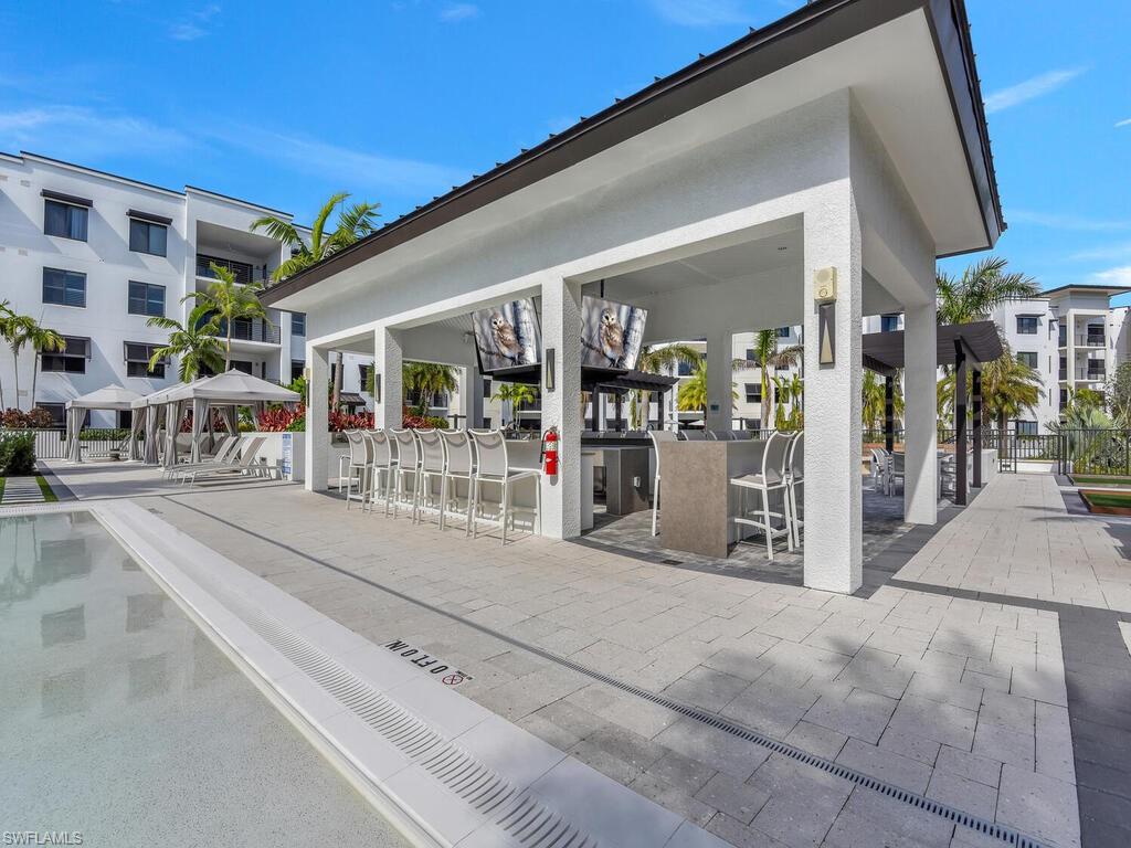 1111 Central Avenue, Unit 216 Naples, FL 34102 - Photo 42 of 50 a view of a building with street