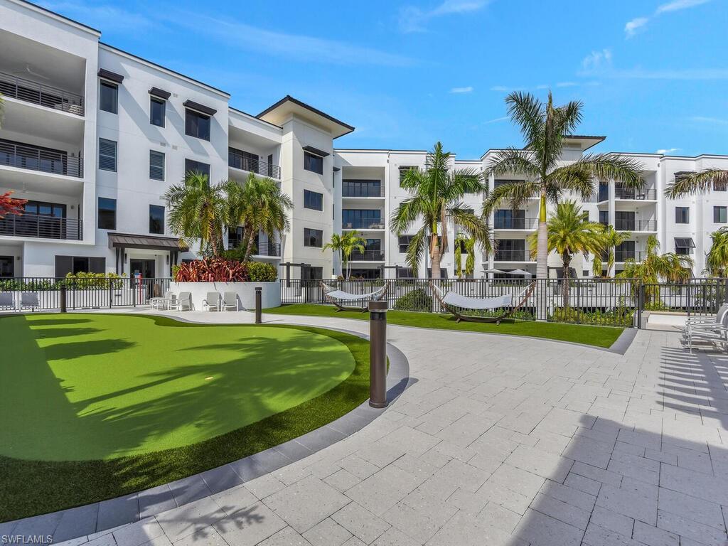 1111 Central Avenue, Unit 216 Naples, FL 34102 - Photo 45 of 50 a front view of building with yard