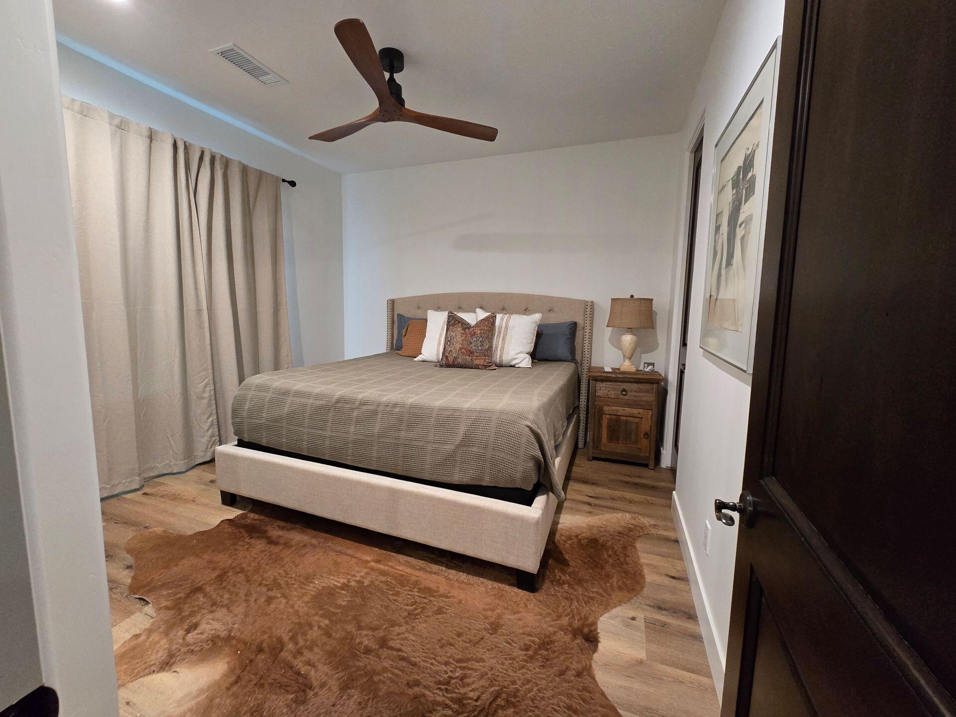 240 Rockinghorse Bend Road Payson, AZ 85541 - Photo 17 of 53 a bedroom with a bed next to a window
