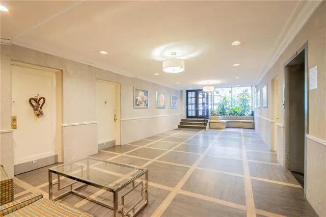 a room with gym equipment and glass windows