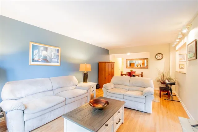 a living room with furniture or couch and a wooden floor