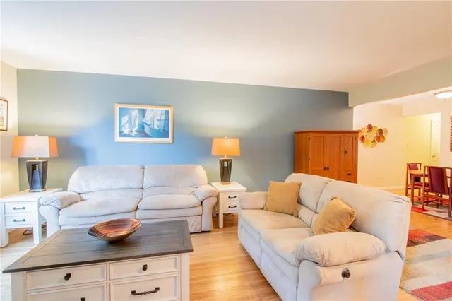 a living room with furniture and a lamp