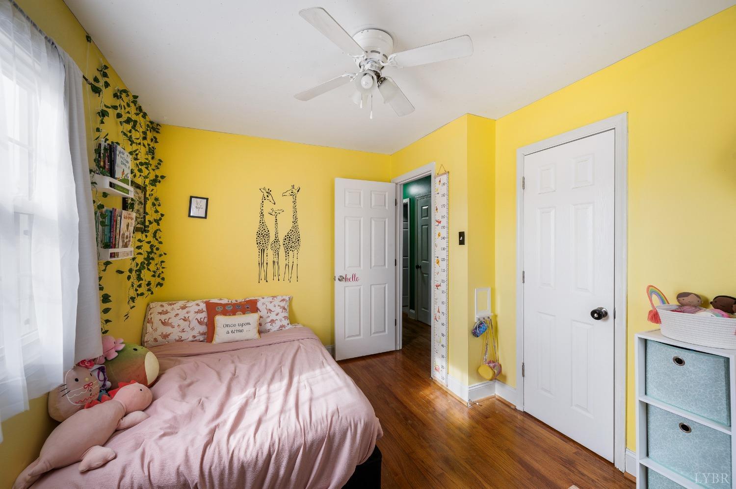 463 Eldon Road Appomattox, VA 24522 - Photo 15 of 32 a bedroom with a bed and a wooden floor