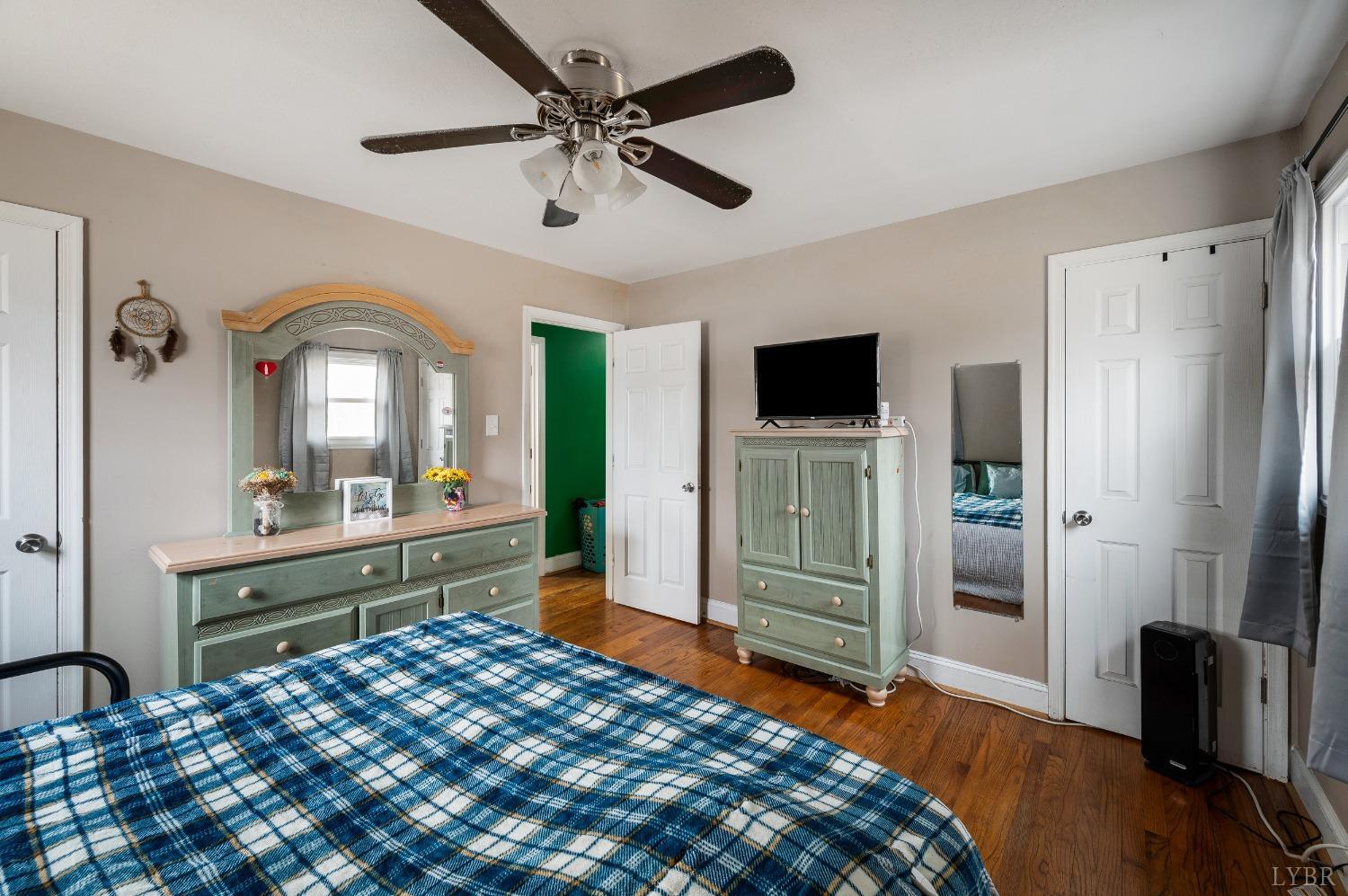463 Eldon Road Appomattox, VA 24522 - Photo 17 of 32 a bedroom with a bed and a large mirror on the dresser