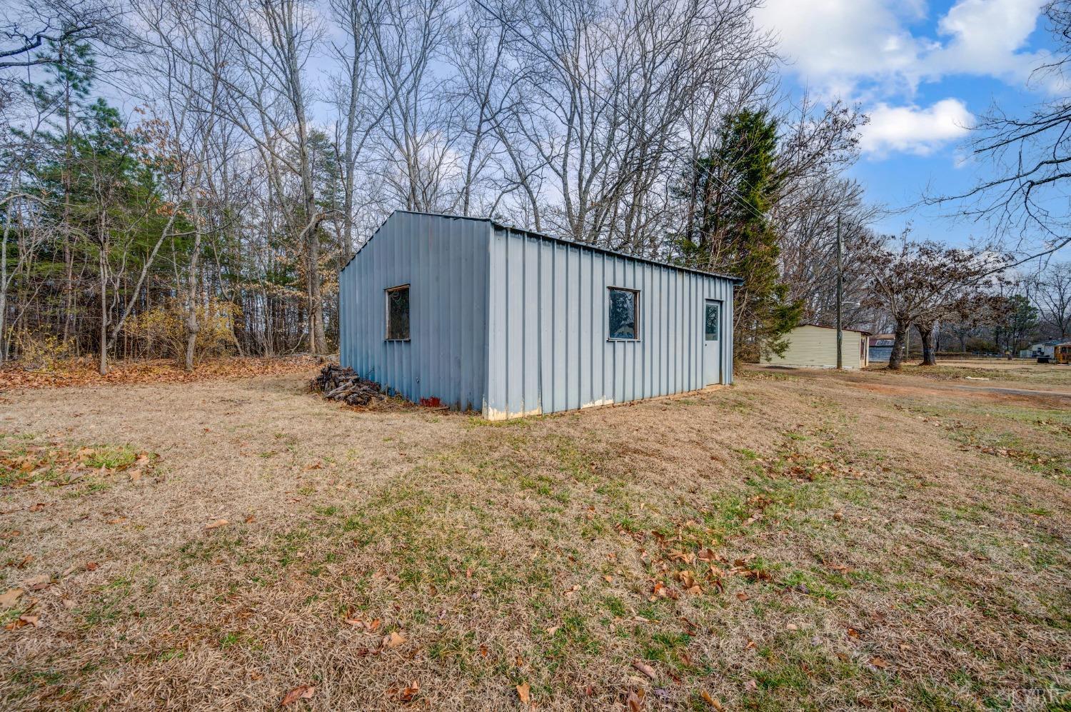 463 Eldon Road Appomattox, VA 24522 - Photo 25 of 32 a front view of a house with a yard covered in snow