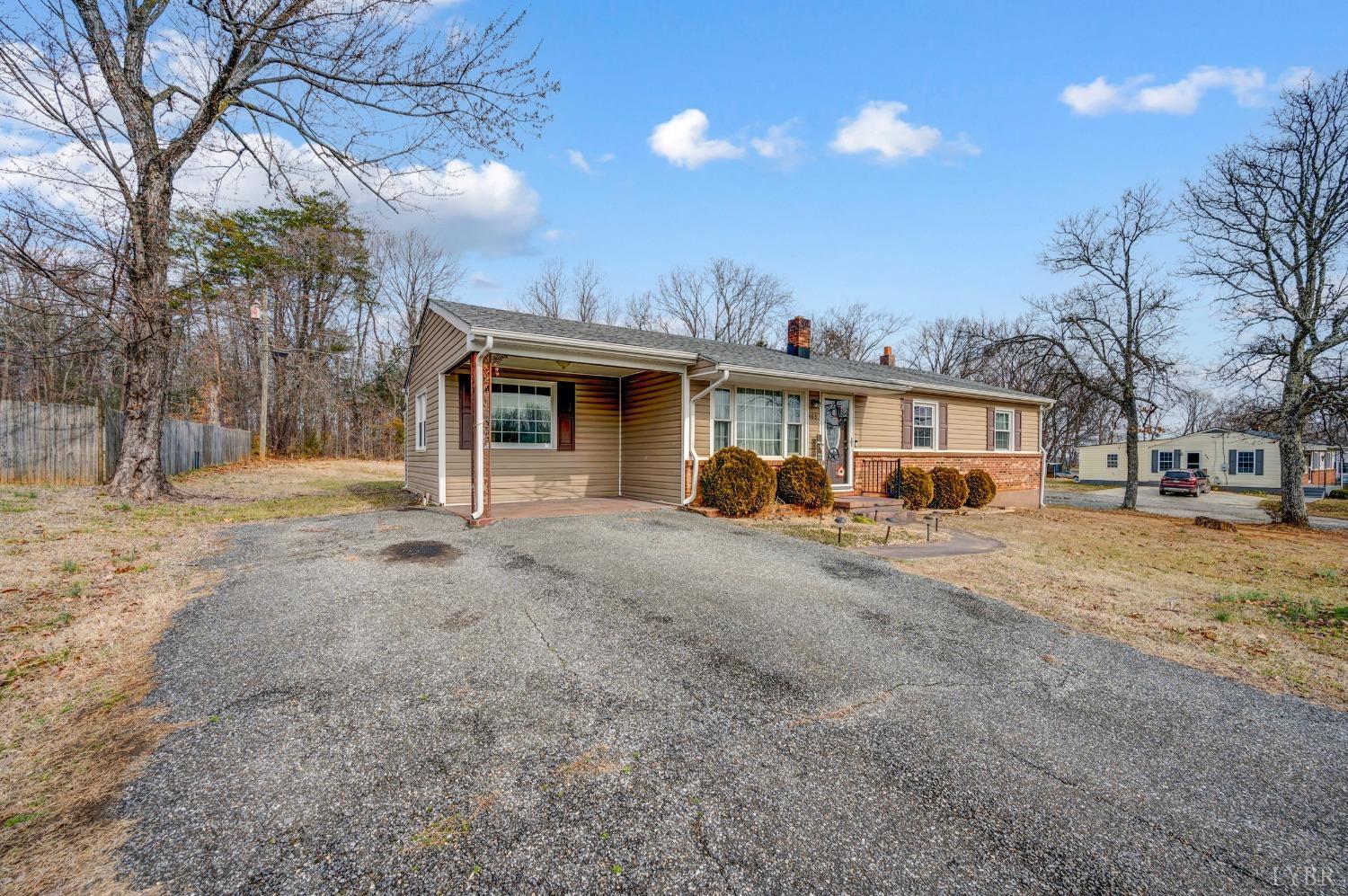 463 Eldon Road Appomattox, VA 24522 - Photo 31 of 32 a view of a house with a yard and garage