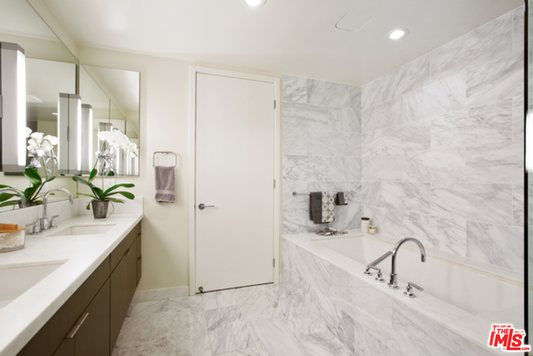 1705 Ocean, Unit 212 Santa Monica, CA 90401 - Photo 11 of 17 a bathroom with a sink and a mirror