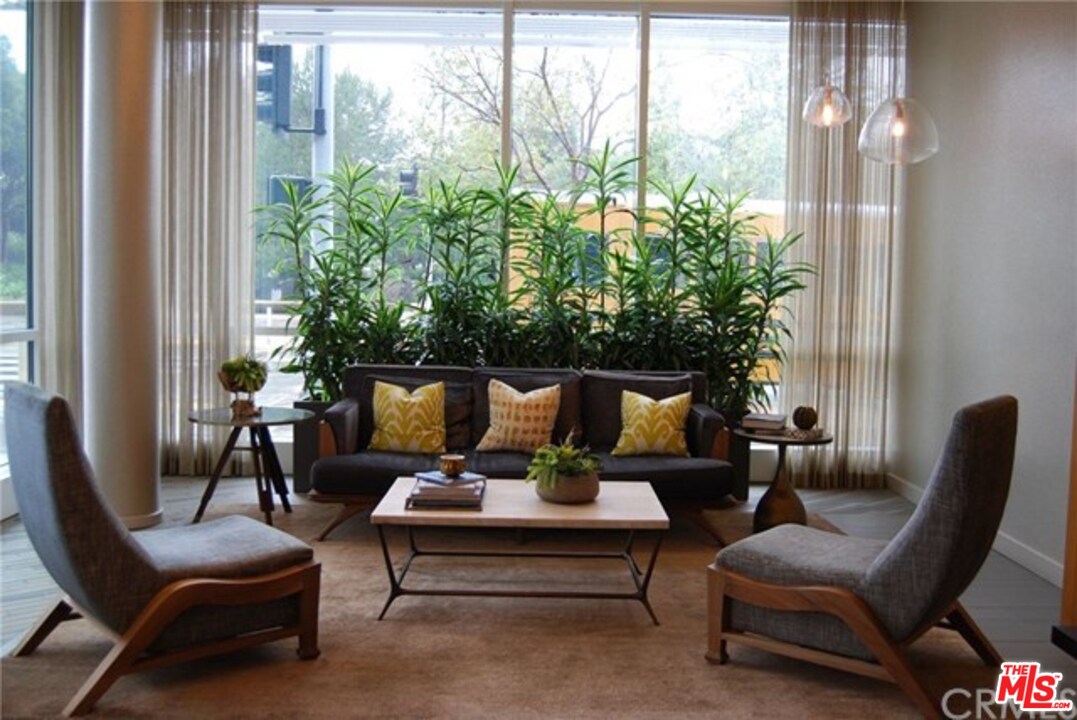 1705 Ocean, Unit 212 Santa Monica, CA 90401 - Photo 17 of 17 a living room with furniture and a potted plant