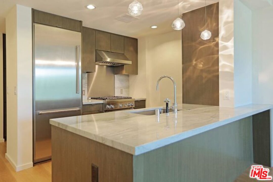 1705 Ocean, Unit 212 Santa Monica, CA 90401 - Photo 9 of 17 a bathroom with a sink and a mirror
