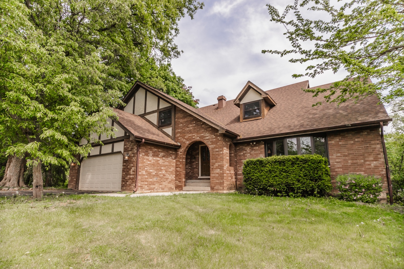 front view of a house with a small yard