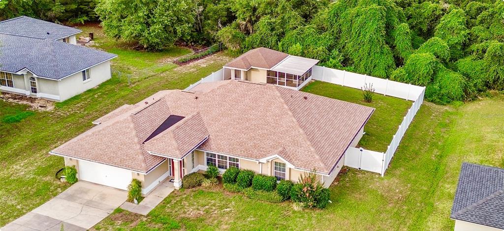 10151 Southwest 41st Terrace Ocala, FL 34476 - Photo 1 of 37 an aerial view of a house with swimming pool and outdoor space