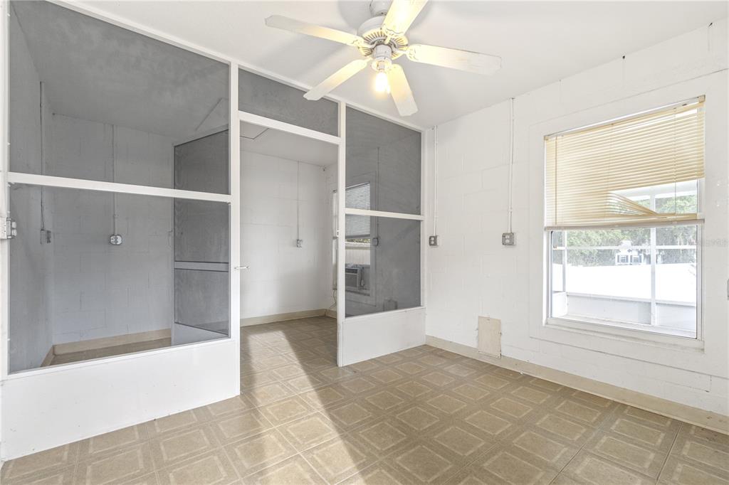 10151 Southwest 41st Terrace Ocala, FL 34476 - Photo 25 of 37 a view of an empty room with window and a chandelier fan