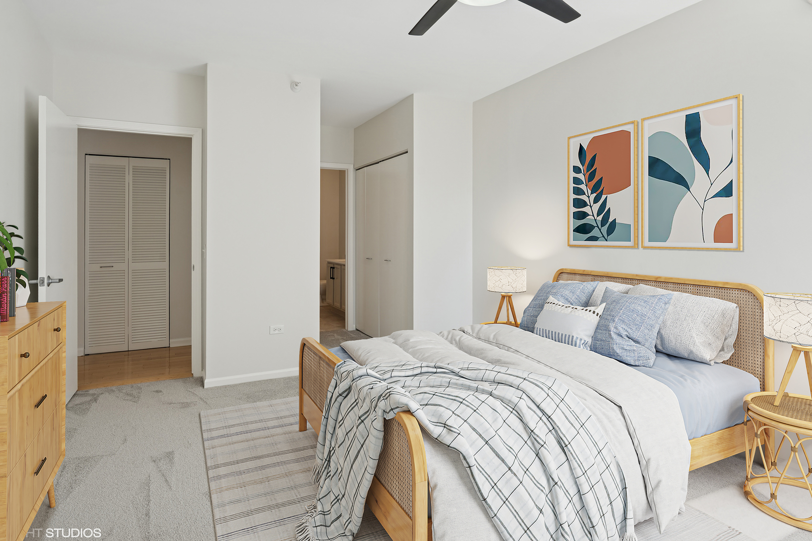 630 North State Street, Unit 1406 Chicago, IL 60654 - Photo 13 of 18 a bedroom with a bed and painting on the wall