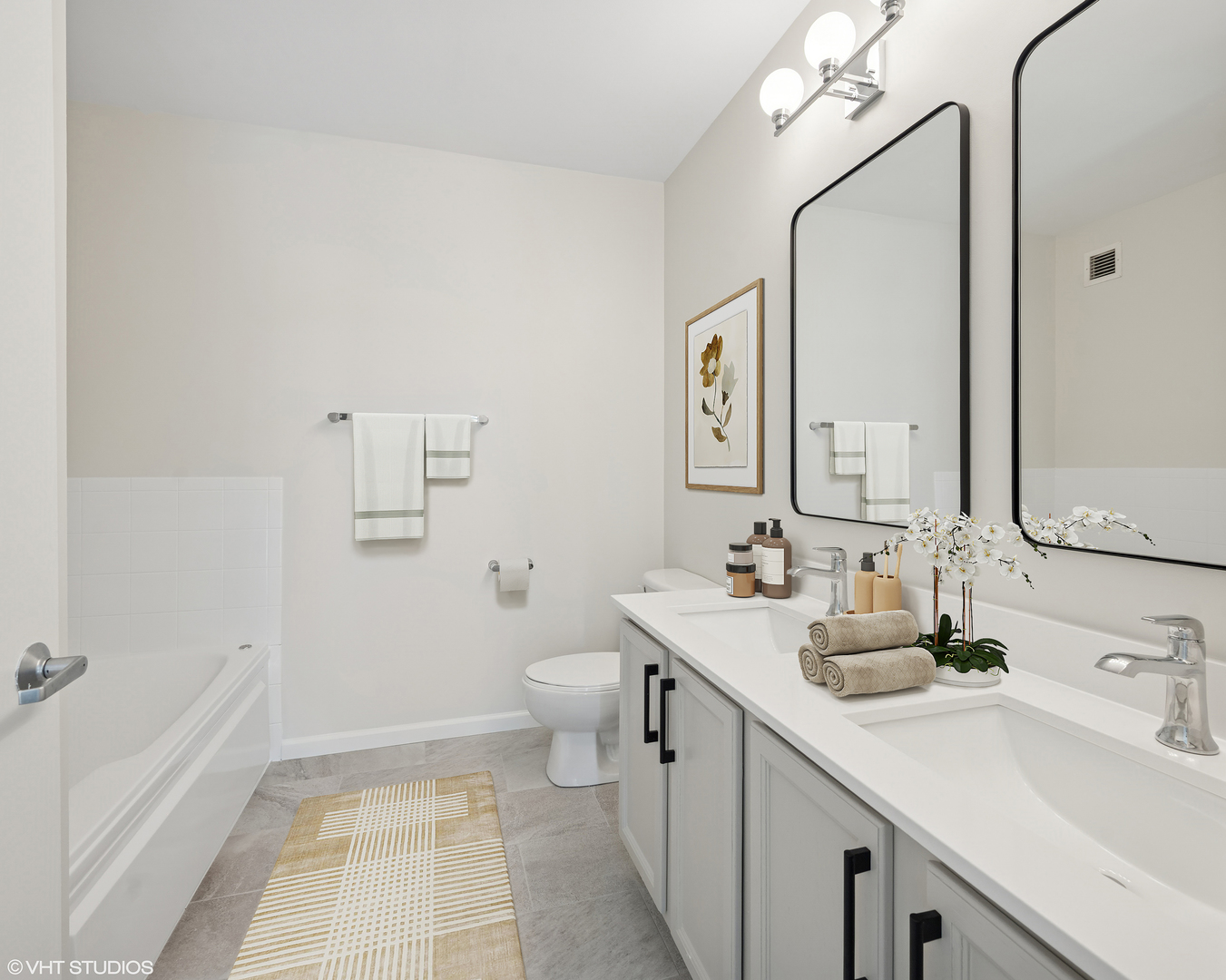 630 North State Street, Unit 1406 Chicago, IL 60654 - Photo 14 of 18 a bathroom with a sink a toilet and mirror