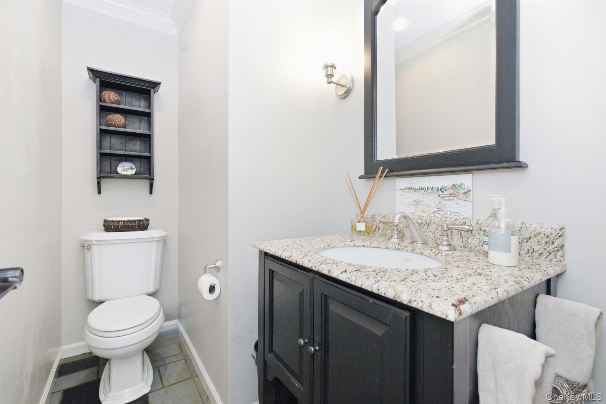 32 Bedell Road Katonah, NY 10536 - Photo 20 of 49 A granite-topped vanity dresses up the main-level half bath.