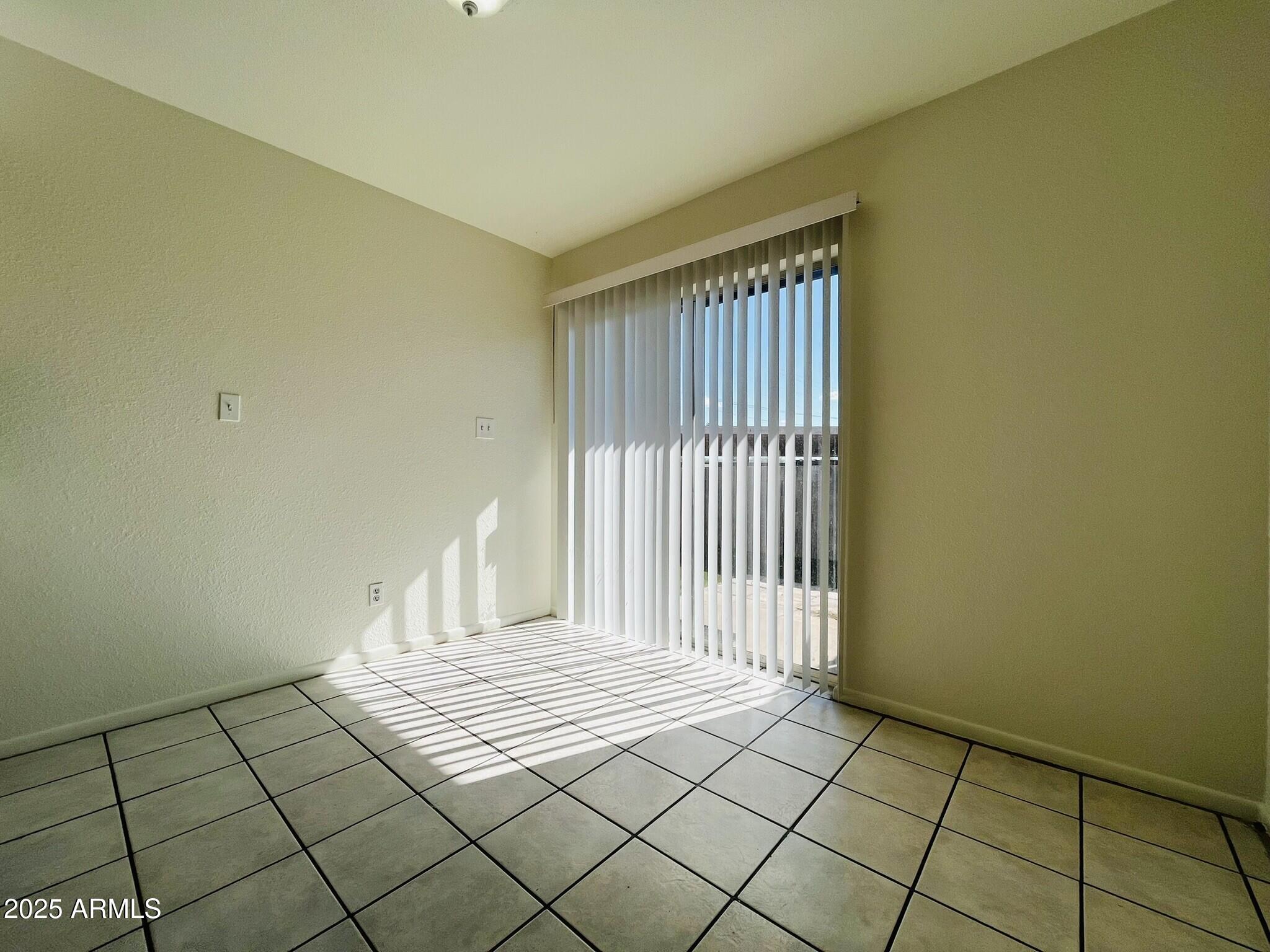 3807 North 23rd Drive, Unit 2 Phoenix, AZ 85015 - Photo 10 of 11 a view of a room with wooden floor