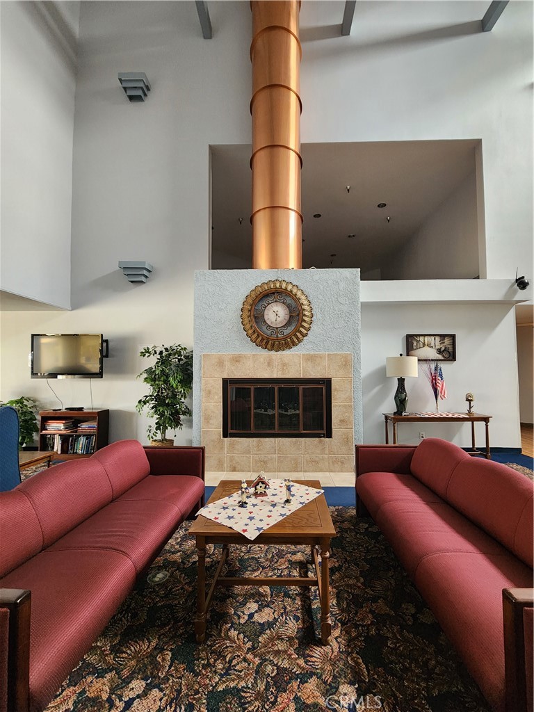 1295 South Cawston Avenue, Unit 267 Hemet, CA 92545 - Photo 28 of 34 Community lounge area with fireplace