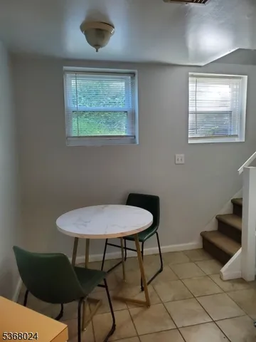 a view of a livingroom with furniture and a potted plant