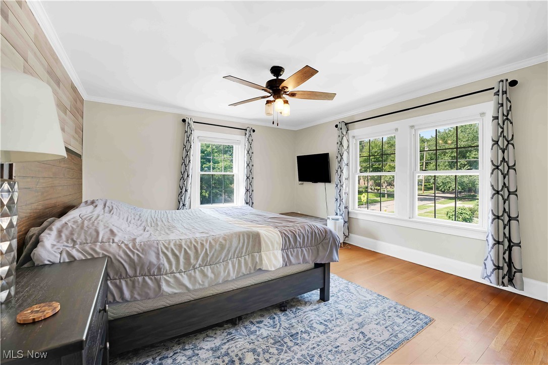 685 Ecton Road Akron, OH 44303 - Photo 24 of 34 Bedroom featuring crown molding, wood finished floors, and ceiling fan