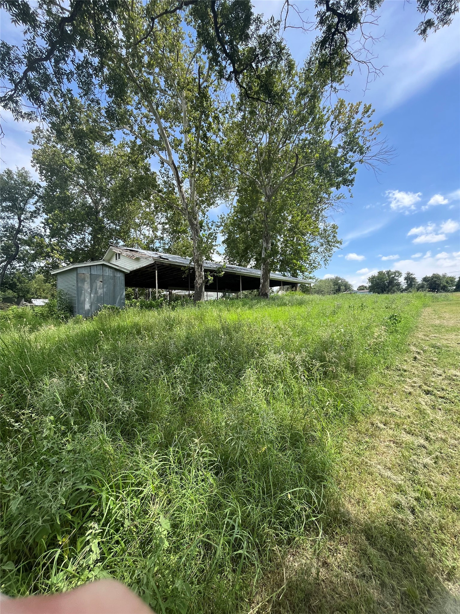 12.1 Beautiful rolling acres on one of the highest points in Horse shoe Bay.  The ranchette has two entries from either the Rocky Road side just west of La Quinta, as well as by entering the entrance to Channel Oaks ll and following the road to the top of the hill where you will find this property.  The property has barns, stalls, some farming equipment, water tank and a large metal building with living quarters and ample work and garage space.
