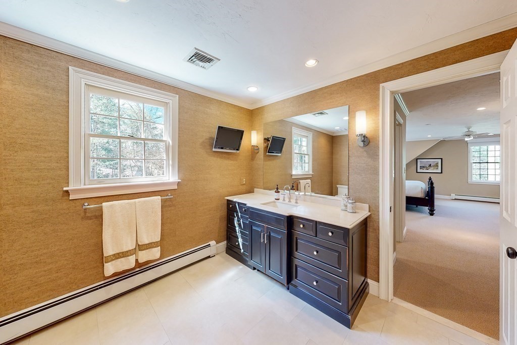 1 Chestnut Lane Medfield, MA 02052 - Photo 21 of 39 a spacious bathroom with a vanity a mirror and a shower