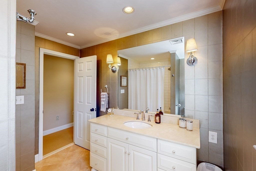 1 Chestnut Lane Medfield, MA 02052 - Photo 23 of 39 a bathroom with a sink a mirror and a shower
